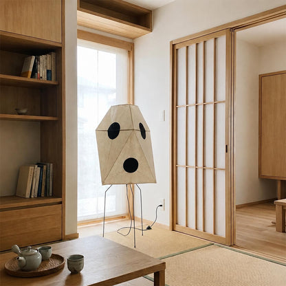 Japandi style geometric paper floor light in a traditional Japanese tatami room with sliding doors.