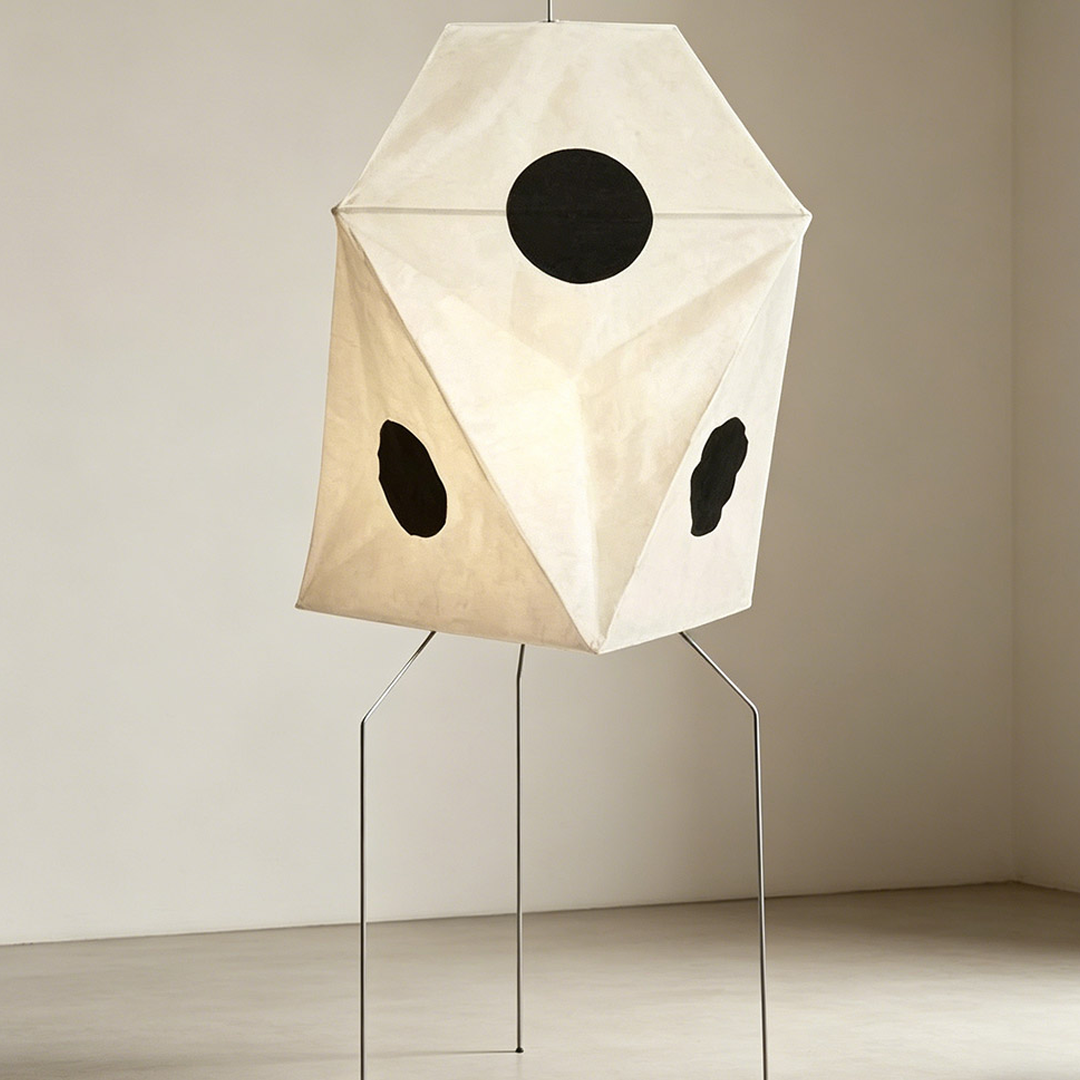 Akari UF3-Q floor lamp in a minimalist Japandi living room next to a designer chair.
