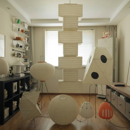 Akari UF3-Q floor lamp in a minimalist Japandi living room next to a designer chair.