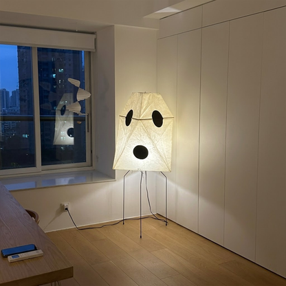 Akari UF3-Q floor lamp in a minimalist Japandi living room next to a designer chair.