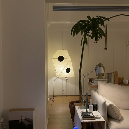 Akari UF3-Q floor lamp in a minimalist Japandi living room next to a designer chair.