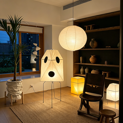 Akari UF3-Q floor lamp in a minimalist Japandi living room next to a designer chair.