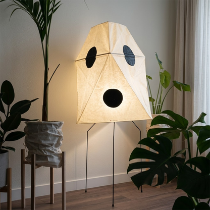 Akari UF3-Q floor lamp in a minimalist Japandi living room next to a designer chair.