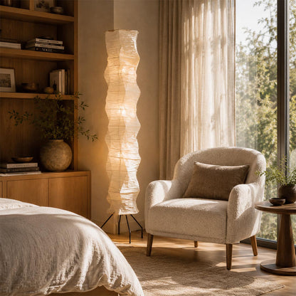 Warm ambient lighting from Akari UF4 33N tall rice paper floor lamp by the bedside - stuberlighting