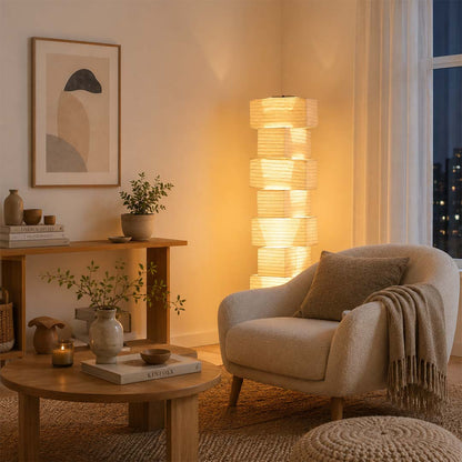 Warm ambient living room lighting with Akari UF4-L10 floor lamp next to armchair - stuberlighting