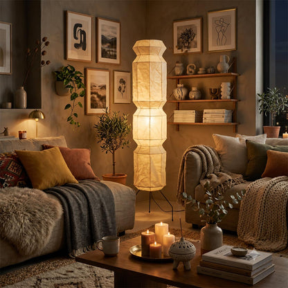 Cozy room reading nook with night view and glowing Akari UF4-L6 vertical lamp - stuberlighting