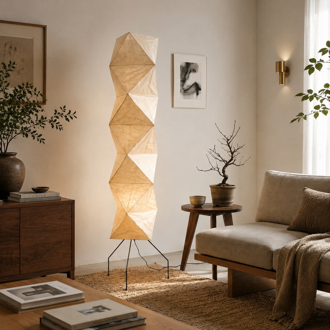 Akari UF4-L8 floor lamp beside sofa living room soft glow washi paper tall sculptural American home lifestyle interior styled
