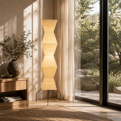 Aesthetic Akari UF4-L9 Paper Lantern Floor Lamp positioned by a glass door with a scenic outdoor garden view by Stuber Lighting.