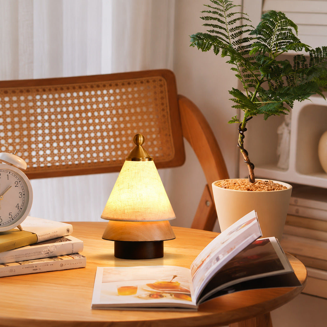 Alberello cordless table lamp on a wooden desk in a cozy home office