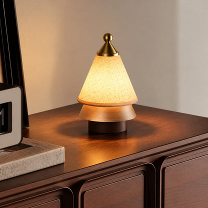 Alberello cordless table lamp on a wooden desk in a cozy home office
