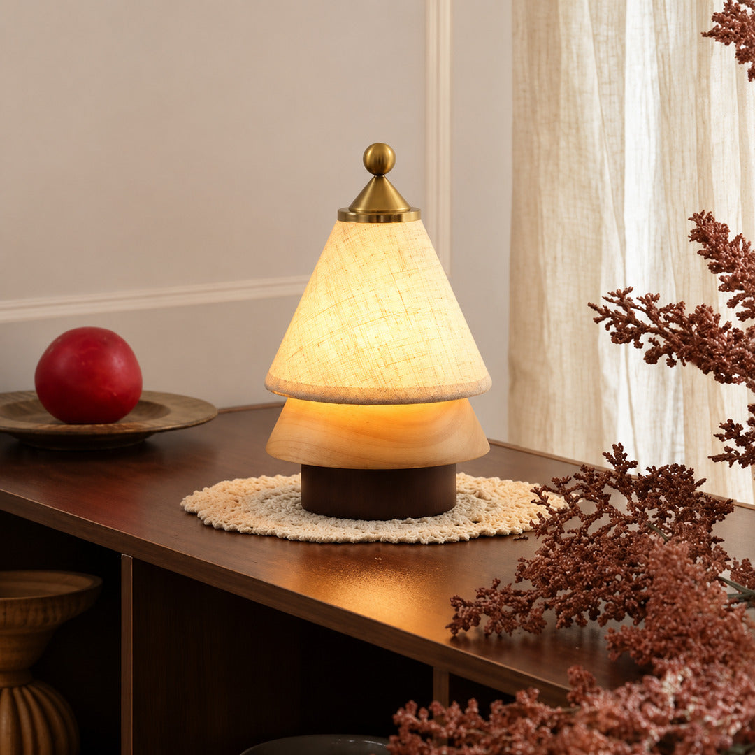 Alberello cordless table lamp on a wooden desk in a cozy home office