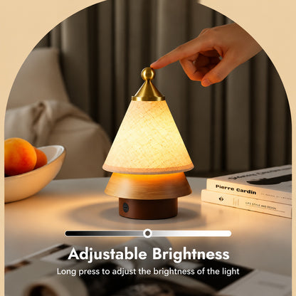 Alberello cordless lamp dimmed from bright to a soft night glow by long-pressing the top
