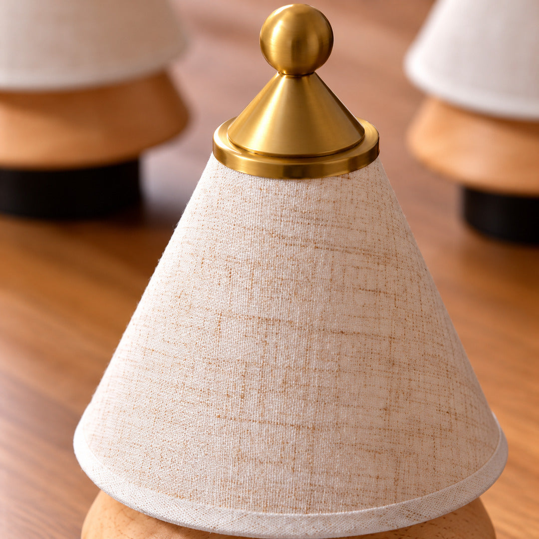 Close-up of the woven fabric shade glowing on the Alberello table lamp