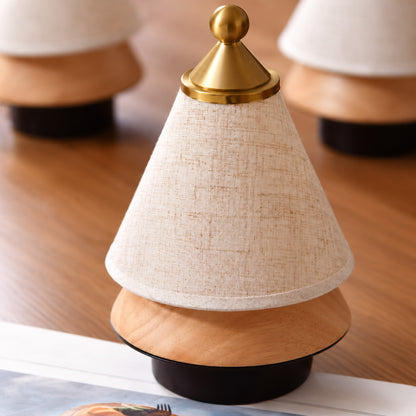 Alberello cordless lamp held in one hand to show its small 7.9 inch size