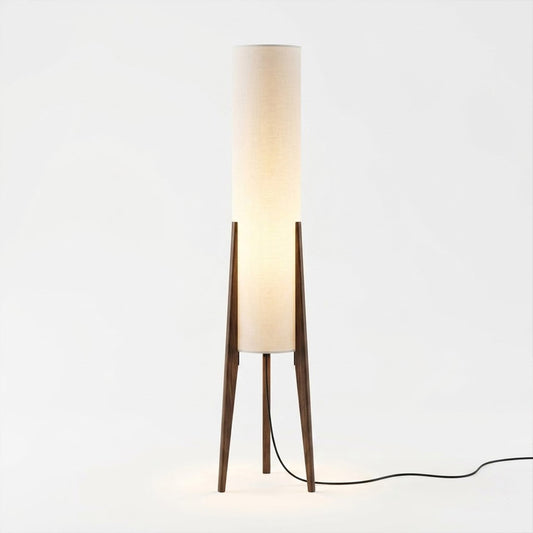 Alto walnut tripod floor lamp beside armchair living room warm light mid century modern interior