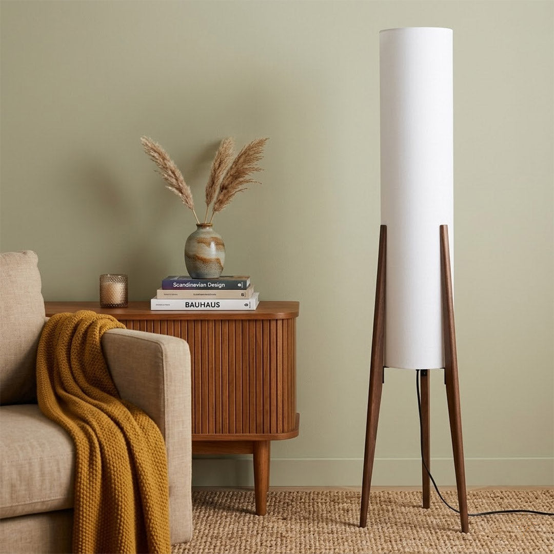Alto walnut tripod floor lamp beside armchair living room warm light mid century modern interior