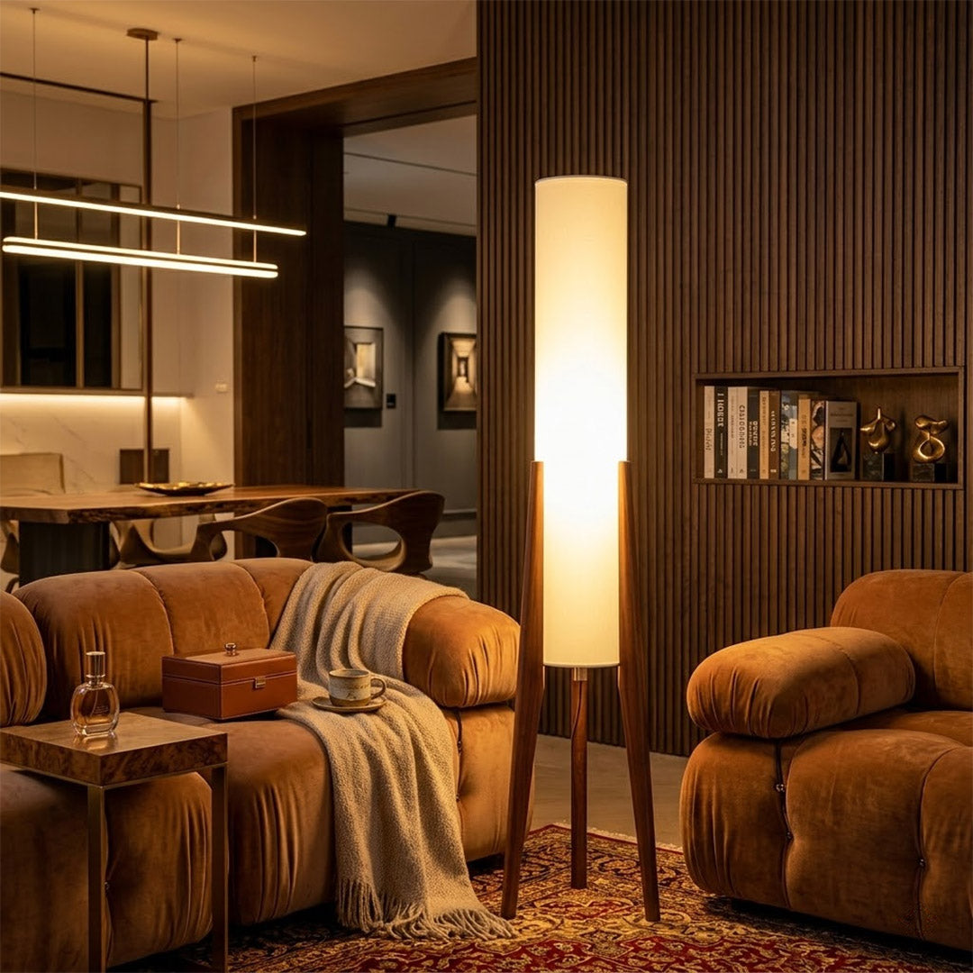 Alto walnut tripod floor lamp beside armchair living room warm light mid century modern interior