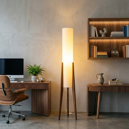 Alto walnut tripod floor lamp beside armchair living room warm light mid century modern interior