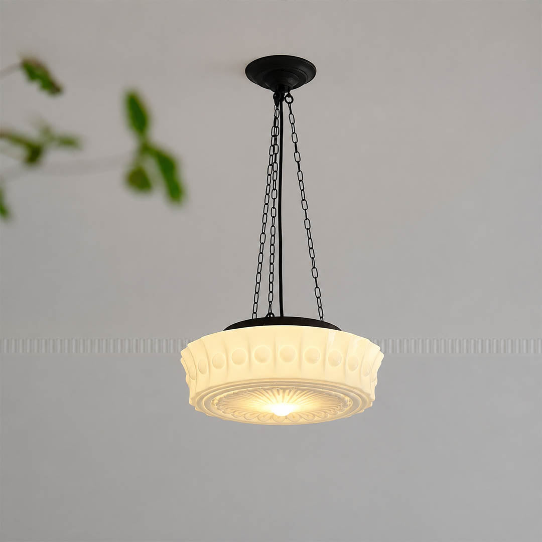 Amalfi round pendant light illuminated warm glow patterned milk glass dome soft textured vintage hanging white background