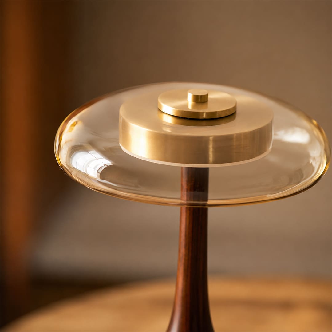 Ambra table lamp signature amber glass shade dome warm golden translucent glow honey rich saturated detail close up craftsmanship