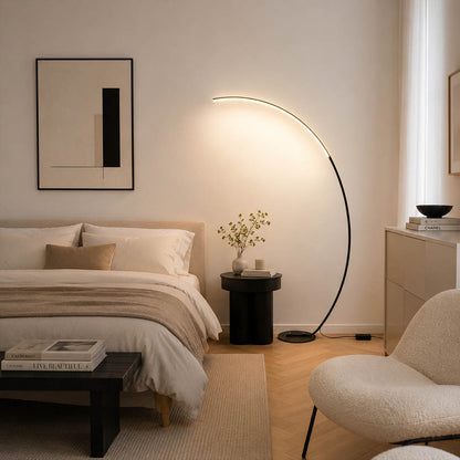 Arco floor lamp white modern primary bedroom overhead reach above bed statement arc curved mid century Italian minimalist warm ambient sculptural elegant lifestyle interior
