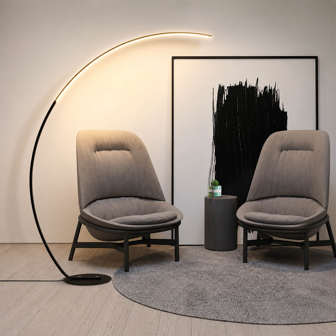 Arco floor lamp black modern lounge seating area conversation zone overhead reach arc curved statement mid century Italian minimalist warm ambient sculptural lifestyle interior