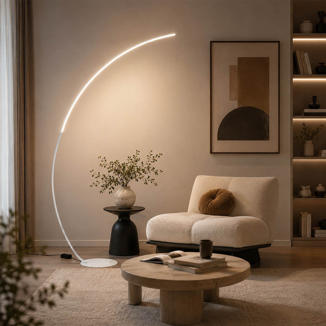 Arco floor lamp black modern living room sectional sofa overhead reach arc curved statement mid century Italian minimalist warm ambient sculptural elegant lifestyle interior