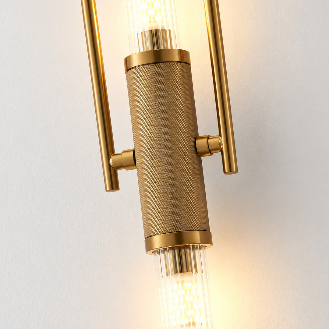 Close-up of the long arched arm of the Arco glass wall sconce curving down to the glass shade