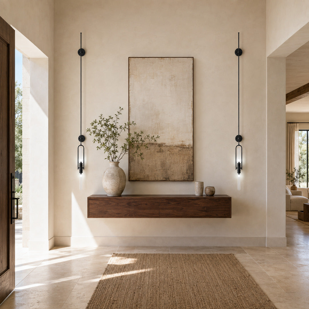 Arco glass wall sconce welcoming guests with a warm arced silhouette above an entry console