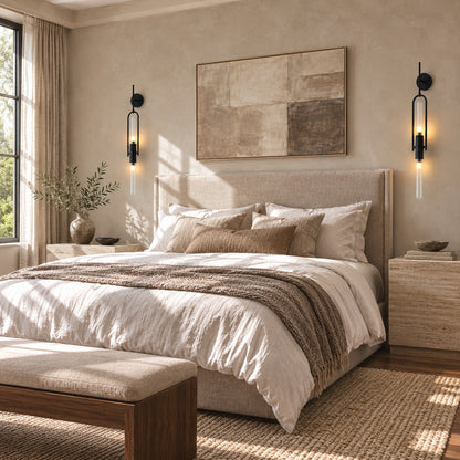 Pair of Arco glass wall sconces flanking a bed as slim arced bedside lights