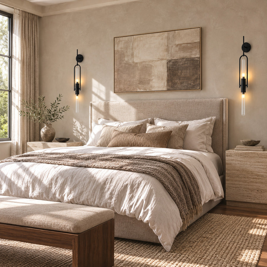 Pair of Arco glass wall sconces flanking a bed as slim arced bedside lights