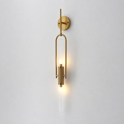 Short 33.5-inch gold Arco glass wall sconce flanking a bathroom vanity mirror