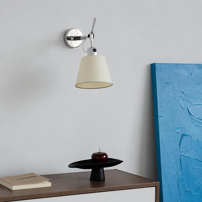Modern Ardsley Swing-Arm Wall Sconce mounted above a wooden sideboard near blue canvas wall art.