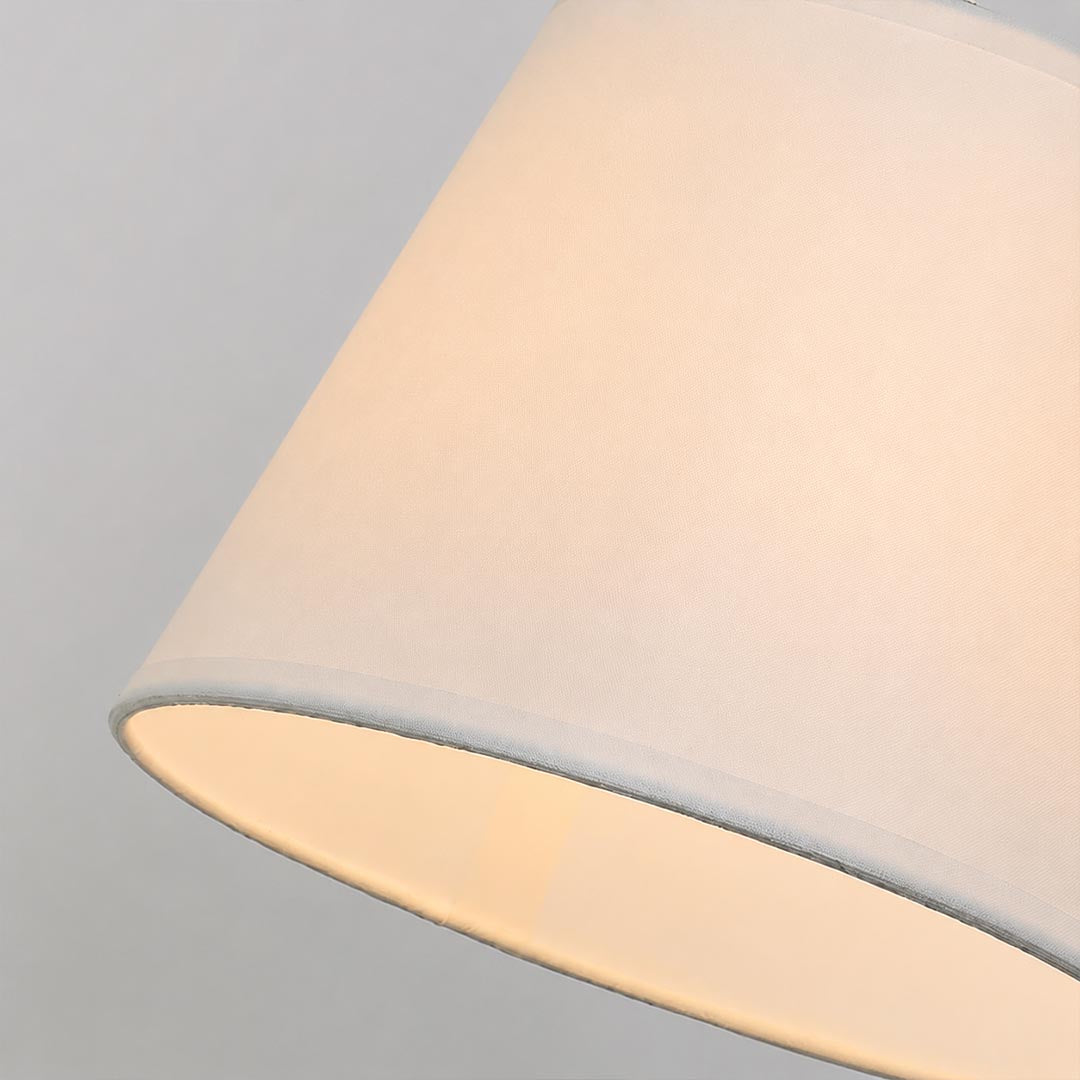 Ardsley swing arm wall sconce fabric shade warm diffused soft glow cozy inviting light detail close up texture