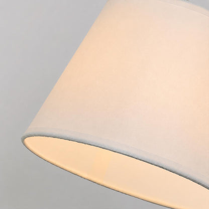 Ardsley swing arm wall sconce fabric shade warm diffused soft glow cozy inviting light detail close up texture