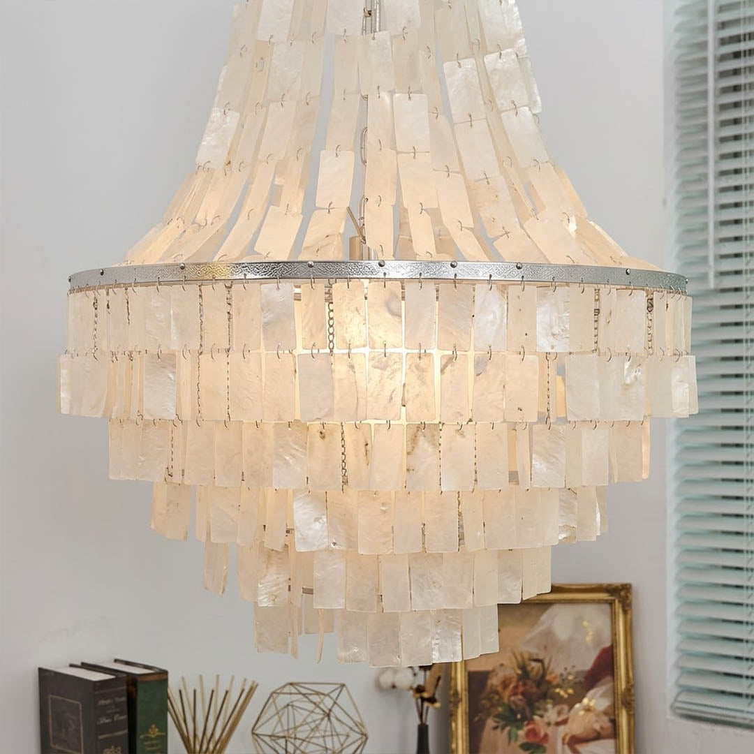 Aria small boho Capiz shell tiered chandelier coastal Bohemian bedroom master primary natural linen rattan warm glow lifestyle interior