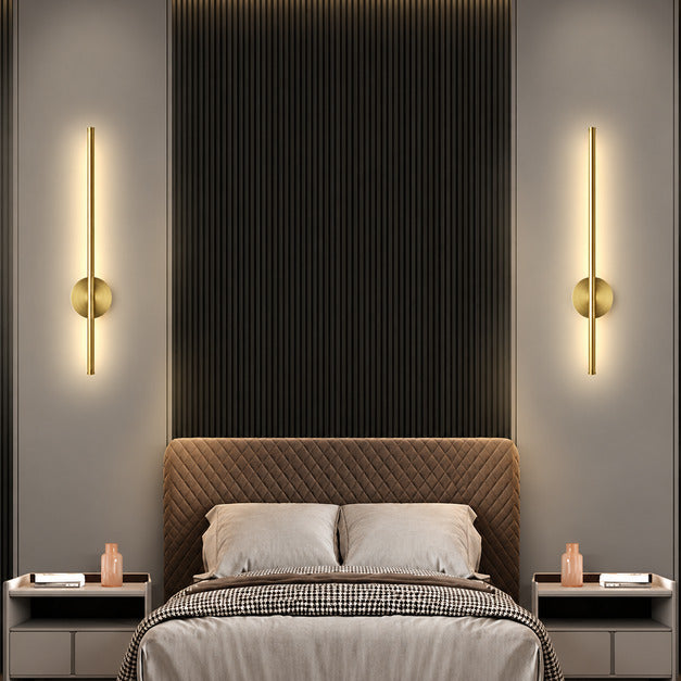 Pair of Asse rechargeable wall sconces flanking a bed as cordless bedside reading lights