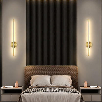 Pair of Asse rechargeable wall sconces flanking a bed as cordless bedside reading lights