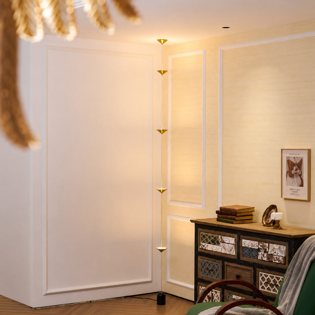 Asta floor lamp reading nook corner warm glow gold black floor to ceiling ambient American home lifestyle interior styled