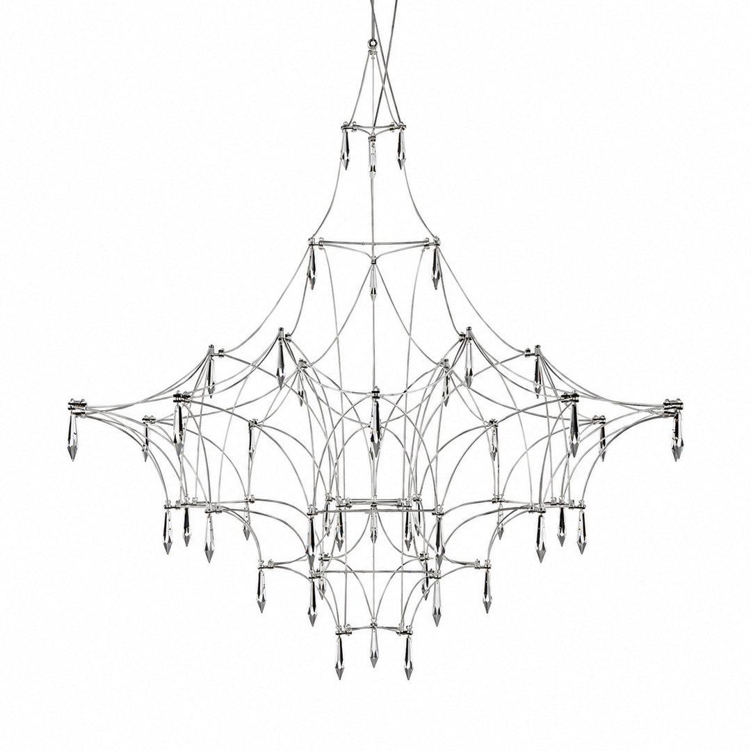 Astra crystal chandelier with a geometric wire frame and teardrop crystals glowing warm over a dining table