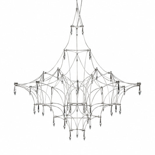 Astra crystal chandelier with a geometric wire frame and teardrop crystals glowing warm over a dining table