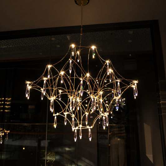 Detail of the geometric stainless steel wire frame of the Astra crystal chandelier