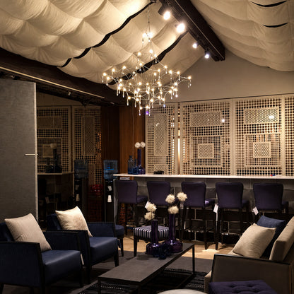 Grand Astra crystal chandelier as a sparkling focal point in a luxury hotel lobby