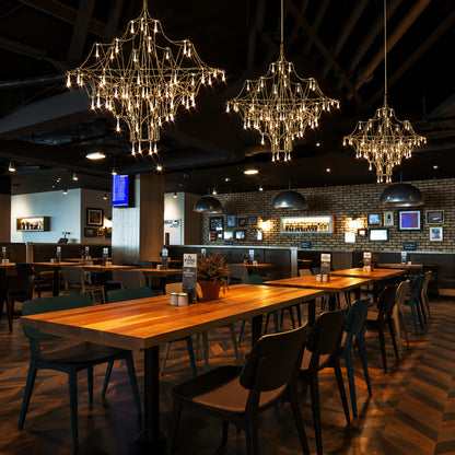 Astra crystal chandelier setting an upscale glamorous mood above a fine-dining table