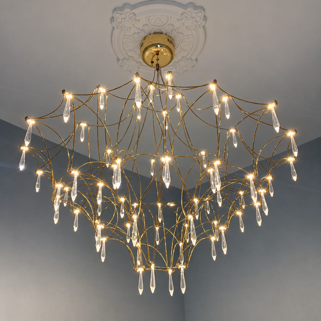 Grand Astra crystal chandelier suspended in a double-height entryway foyer