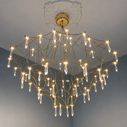 Grand Astra crystal chandelier suspended in a double-height entryway foyer