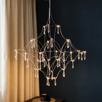 Gold Astra crystal chandelier complementing a modern luxe interior with sparkling crystals