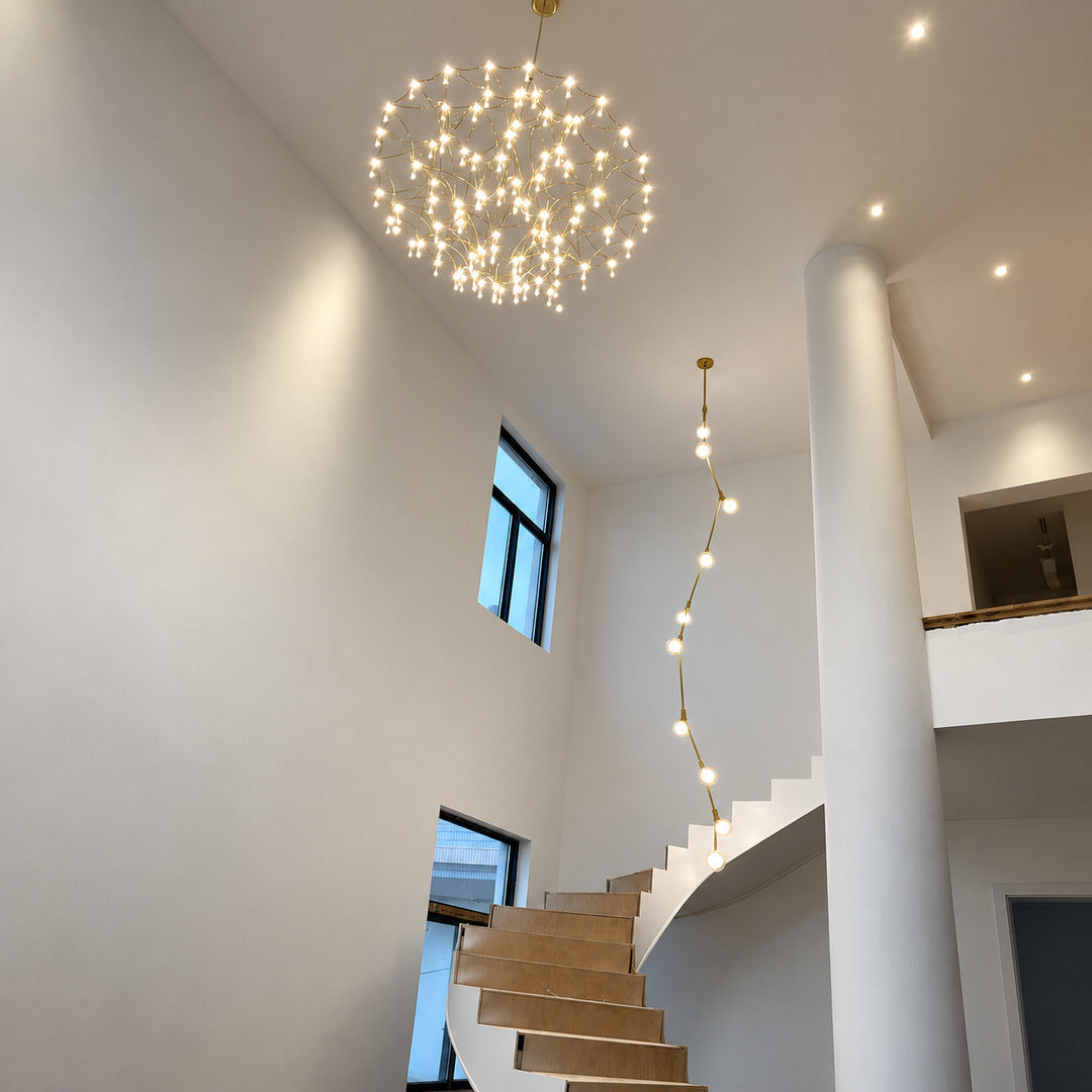 Astra crystal chandelier cascading down an open staircase stairwell with sparkling crystals