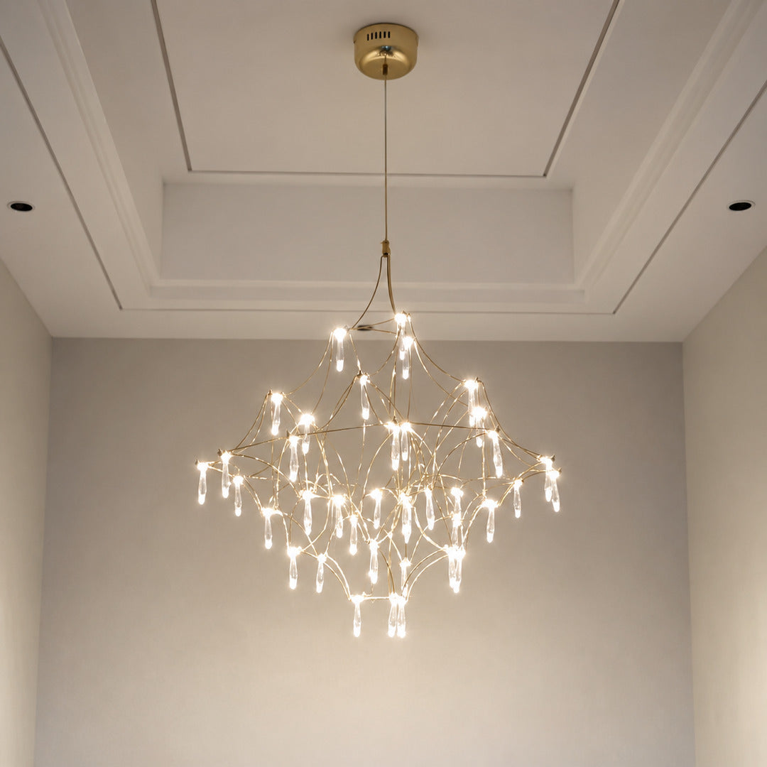 Grand Astra crystal chandelier suspended in a double-height entryway foyer