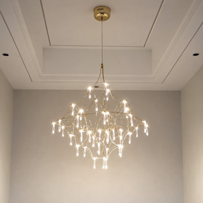 Grand Astra crystal chandelier suspended in a double-height entryway foyer